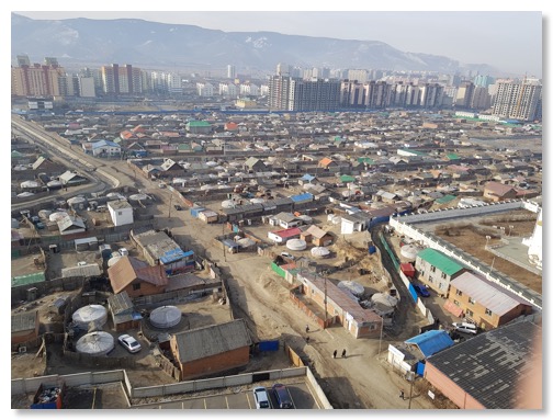 The_private_sector_with_yurts_against_the_backdrop_of_high-rise_new_buildings_in_Ulaanbaatar
